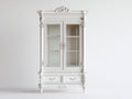 Vitrinas de madera manufacturada y vidrio 108 x 45 x 210 cm - Blanco marfil - 2 puertas y 2 cajones con diseño barroco